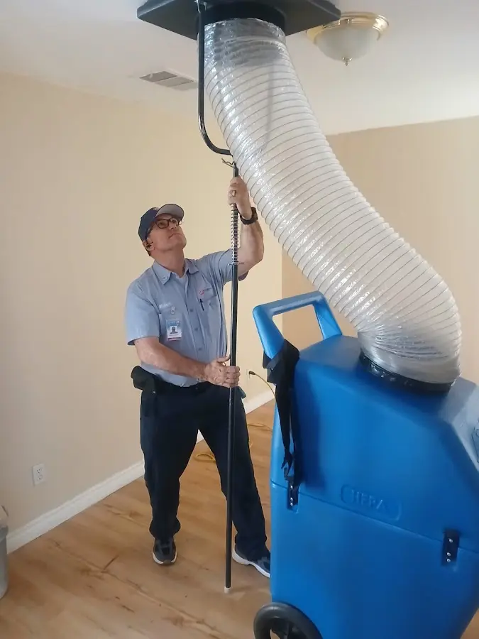 Furnace Tune-Up technician using HEPA equipment in San Anselmo